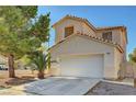Charming two-story home featuring a well-maintained lawn, mature trees, and a two-car garage, offering curb appeal and convenience at 8040 Tailwind Ave, Las Vegas, NV 89131