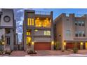 Contemporary three-story home features a balcony, rooftop deck, two-car garage, and neutral exterior paint at 8092 Haywood Estate Ave, Las Vegas, NV 89113
