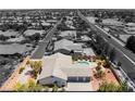Monochrome aerial view of house showing backyard pool and outdoor lounge area at 8125 Soledad Canyon St, Las Vegas, NV 89131