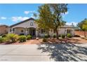 Charming single-story house with desert landscaping, a blue front door, and a wide walkway at 8125 Soledad Canyon St, Las Vegas, NV 89131