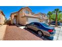 Charming two-story home with a tile roof, manicured landscape, and an inviting entrance for memorable curb appeal at 8370 Lost Lake Ct, Las Vegas, NV 89147