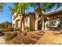 Beautiful single-Gathering home with manicured desert landscaping and inviting curb appeal at 10002 Trapper Mountain St, Las Vegas, NV 89178