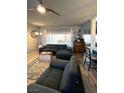 Comfortable living room with large sectional sofa, stylish flooring, neutral walls, and bright window at 1198 Golf Club, Laughlin, NV 89029
