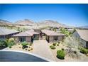 Beautiful single-story home with lush landscaping, stone accents, and a well-maintained front yard at 12168 Dorada Coast Ave, Las Vegas, NV 89138