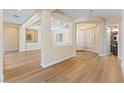 Bright and airy living room with elegant hardwood floors and sophisticated architectural details at 12168 Dorada Coast Ave, Las Vegas, NV 89138