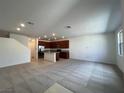 Open-concept living room and kitchen featuring modern finishes at 1467 Melodic Lark Ln, Las Vegas, NV 89138