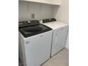Laundry area featuring a white, front-load washing machine and dryer at 2536 Vandra St, Las Vegas, NV 89138