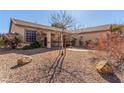 Inviting front yard with low-maintenance desert landscaping and mature trees at 286 Fairmeadow St, Henderson, NV 89012