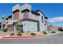 Modern two-story gray home with a garage, landscaping, and a Centano and Luminosa street sign at 3210 Centano Ave, Henderson, NV 89044