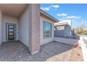 Inviting covered courtyard with stylish stone accents and a welcoming entrance at 421 Point Sur Ave, Las Vegas, NV 89138