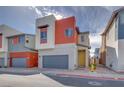 Charming two-story home with modern design, grey garage door, and red accent wall at 4349 Tabor Peak Ave, Las Vegas, NV 89141