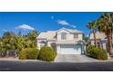 Charming two-story home featuring a well-manicured lawn and a two-car garage in a sunny, suburban neighborhood at 6259 Santander Ave, Las Vegas, NV 89103