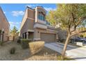 Charming two-story home with a well-maintained front yard and attached two-car garage at 6837 Dragonfly Rock St, Las Vegas, NV 89148