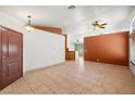 Spacious living room featuring tile flooring, neutral walls, and ample natural light at 688 Arrowhead Canyon Dr, Henderson, NV 89002