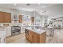 Spacious kitchen with stainless steel appliances, dual islands, and natural light from the many windows at 7410 Bridlehorne Ave, Las Vegas, NV 89131
