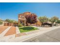 Two-story house featuring desert landscaping, lawn, and neutral-tone exterior paint at 7690 Morning Lake Dr, Las Vegas, NV 89131