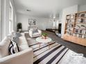 Bright living room with natural light, modern decor, and a stylish striped rug at 983 Plantain Lily Ave, Las Vegas, NV 89183