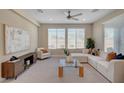 Bright living room showcasing a stylish entertainment center, lots of light, and plush furnishings at 9903 Spinel Pl, Las Vegas, NV 89143