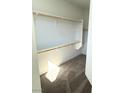 Spacious walk-in closet with white shelving and rod offers ample storage for an organized wardrobe at 11423 Ethereal Landing Ave, Las Vegas, NV 89138