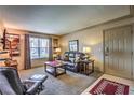 Cozy living room showcasing neutral walls, plush carpet, and comfortable furniture at 1150 N Buffalo Dr # 1022, Las Vegas, NV 89128