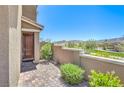 Home's entry featuring a brick walkway and private courtyard at 12536 Blissful Sky St, Las Vegas, NV 89138