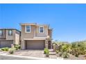 Two-story home with two-car garage, brick driveway, and mountain views at 12536 Blissful Sky St, Las Vegas, NV 89138