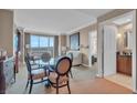 Cozy dining area featuring a glass table, comfortable seating, and a scenic view at 135 E Harmon Ave # 1102, Las Vegas, NV 89109