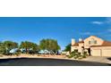 This two-story home has desert landscaping, a terracotta roof, and a two-car garage set on a cul-de-sac at 1915 Hazeltine Ct, Henderson, NV 89074