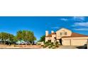 This charming home sits on a corner lot and features desert landscaping, a terracotta roof, and a two-car garage at 1915 Hazeltine Ct, Henderson, NV 89074
