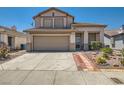 Charming two-story home featuring a two-car garage and low-maintenance desert landscaping at 2341 Steinke Ln, Las Vegas, NV 89108