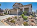 Lovely two story home with desert landscaping, featuring cactus, rocks, and stone accents at 2341 Steinke Ln, Las Vegas, NV 89108