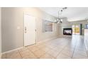 Bright living room features tile flooring, a fireplace, and neutral tones, ideal for relaxing at 2407 Belt Buckley Dr, Henderson, NV 89002
