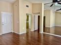 Hardwood floors in an open-concept living room lead to the kitchen and entry way at 2609 Sierra Sage St, Las Vegas, NV 89134