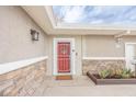 The home features a welcoming front entrance with a vibrant red door and stylish stone accents at 2819 Taylor Ave, North Las Vegas, NV 89030