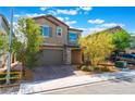 Charming two-story home featuring a two-car garage, desert landscaping, and a welcoming facade at 2964 Gunnery Forge St, Las Vegas, NV 89156