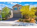 Charming two-story home featuring a two-car garage, desert landscaping, and a welcoming facade at 2964 Gunnery Forge St, Las Vegas, NV 89156