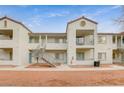 Multi-unit dwelling boasts a well-maintained exterior with balconies and stairways under a partly cloudy sky at 3318 N Decatur Blvd # 1061, Las Vegas, NV 89130