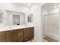 Bright bathroom featuring a double vanity and a walk-in shower at 3518 Herodain Ave, Las Vegas, NV 89106