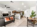 Open-concept living space featuring modern furnishings and stainless steel appliances at 3518 Herodain Ave, Las Vegas, NV 89106
