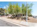 Cozy home featuring desert landscaping and shade trees at 429 Scenic Dr, Henderson, NV 89002