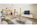 Inviting living room that flows into dining area with hardwood floors at 429 Scenic Dr, Henderson, NV 89002