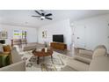 Bright living room featuring neutral furniture, wood flooring, and stylish decor accents for a modern feel at 4442 Bennett Dr, Las Vegas, NV 89121