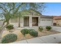 Charming single-story home with desert landscaping in the front yard at 5833 Craigmore Ln, North Las Vegas, NV 89031