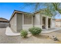 Charming single-story home featuring desert landscaping and a stone walkway at 5833 Craigmore Ln, North Las Vegas, NV 89031