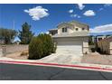 Two story home featuring a driveway leading to a two-car garage and a detached one-car garage at 7748 Catalina Harbor St, Las Vegas, NV 89131