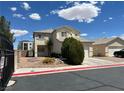 Two story home featuring a driveway leading to a two-car garage and a detached one-car garage at 7748 Catalina Harbor St, Las Vegas, NV 89131