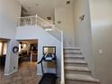 Open floor plan with staircase and view of the living room at 8345 Mozley Park St, Las Vegas, NV 89113