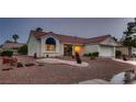 Charming single-story home with a well-manicured desert landscape and classic architectural details at 8613 Linderwood Dr, Las Vegas, NV 89134