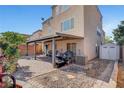 Charming backyard with a covered patio, shed, and low-maintenance landscaping at 9065 W Torino Ave, Las Vegas, NV 89148