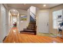 Inviting foyer with hardwood floors, staircase, and ample natural light at 9065 W Torino Ave, Las Vegas, NV 89148
